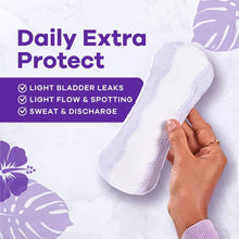 Extra-long panty liner held in hand; white liner with stitched lavender edges