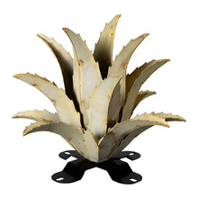 Metal agave yard sculpture with spiky pale gold leaves and star-shaped black feet stand