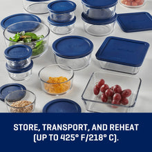 Clear glass food storage containers with blue lids for storing and reheating