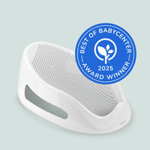 White and gray baby bath support with circular award seal