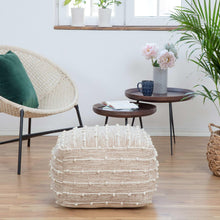 Woven wool pouf with rounded top, striped cream and beige rows.