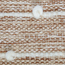 Close-up of woven wool pouf fabric: cream, beige, and tan stripe stitch rows.