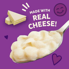 Creamy macaroni and cheese in a spoon, with cheese block graphic.