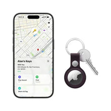 Apple AirTag on keyring tag with smartphone showing location