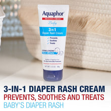 Aquaphor Baby 3-in-1 diaper rash cream tube on soft fabric