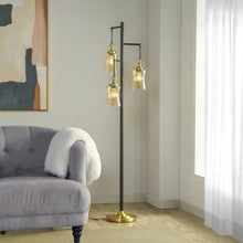 3-light floor lamp, black pole, brass base, three clear glass shades