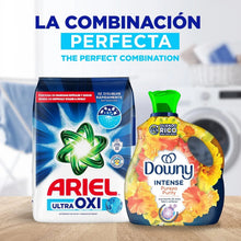 Ariel Ultra Oxi laundry detergent bag with a yellow liquid bottle next to it
