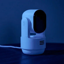 Indoor pan-tilt security camera with blue-lit white body and black lens module