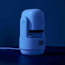 Indoor pan-tilt security camera side view with white body and black lens module