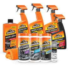 Car care cleaning kit set with orange spray bottles, wipes, and microfiber towel