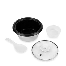 Rice cooker accessories: black inner pot, clear lid, spoon, and outer base