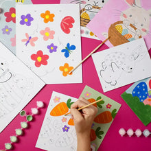 Paint-by-number template sheets with flower and bunny outlines