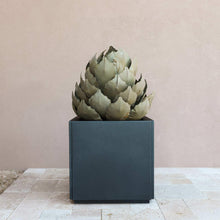 Agave artichoke metal sculpture on dark rectangular base, layered leaf petals in sage bronze