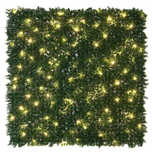 Artificial hedge wall panel with warm white lights and dense green leaves