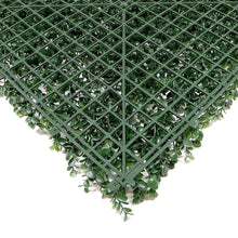 Artificial hedge wall panel close-up: green leaves on dark lattice backing