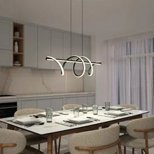 LED pendant light with three looping arms in black and cream, hanging from two cords