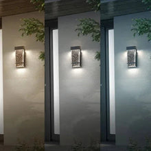 Black rectangular wall sconce with speckled bubble-glass shade