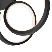 Black LED ring with bright inner light, part of swirl ribbon pendant
