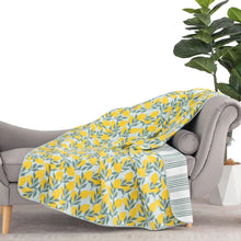 Yellow leaf print cotton gauze throw with lightweight textured weave