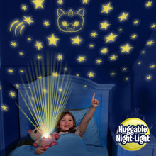 Blue plush puppy night-light beside kid on bed, glowing star belly