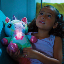 Blue plush puppy night-light with glowing star belly, held by child