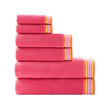 Pink towel set with multicolor striped edging, neatly stacked