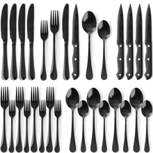 Black and silverware set with steak knives, forks, and spoons for table service.