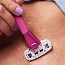 Super Pink razor with 5-blade head shaving on skin