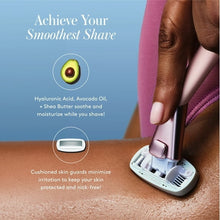 Pink women's razor gliding on leg skin