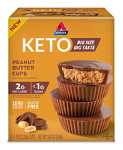Atkins Keto peanut butter cups box, orange packaging with dark chocolate cups stacked