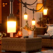 Warm white string light bulbs hanging from a black cable