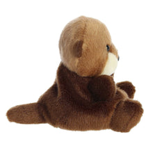 Brown mini sea otter plush, side view with white muzzle and outstretched flippers