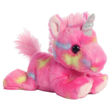 Pink plush unicorn stuffed animal with black bead eyes, rainbow face, silver horn