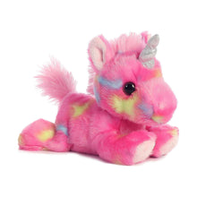 Pink plush unicorn stuffed animal posed sitting, with rainbow markings and silver horn