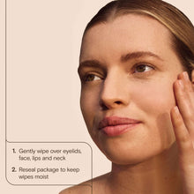 Facial wipe pressed onto cheek and jawline on face