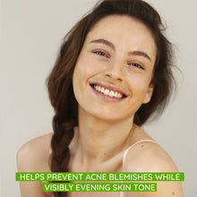 Facial moisturizer on skin while a woman applies it to her cheek