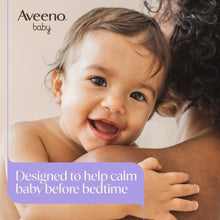 Smiling baby beside Aveeno baby calming comfort bath and lotion set with lavender caps