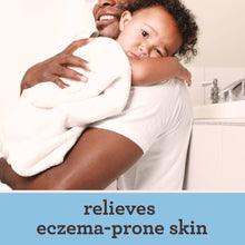 Aveeno baby eczema therapy nighttime balm ad showing parent holding baby