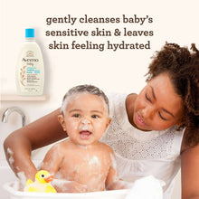 Aveeno baby bubble bath bottle in a bathtub with baby and bubbles