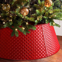 Red metal tree collar with textured brick pattern and curved rim edge.