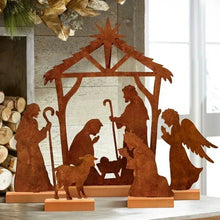 Rusty metal nativity scene tabletop decoration with stable, Mary, baby Jesus and angels
