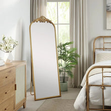 Full length floor mirror with gold arched frame and detailed filigree crown
