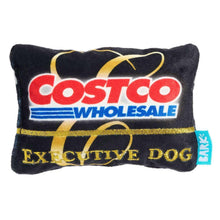 Plush rectangular dog toy with Costco Wholesale logo and text on dark fabric