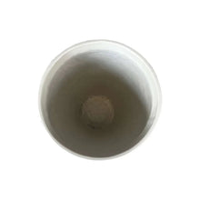 Light gray speckled gypsum planter with circular top opening