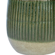 Green sable planter with vertical ribbed texture and speckled beige lower half