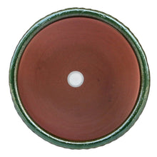 Green sable planter base underside with drainage hole and glossy rim