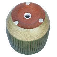 Green sable planter underside with central drainage opening and raised support feet