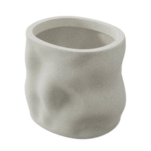White resin planter with smooth rounded sides and speckled finish