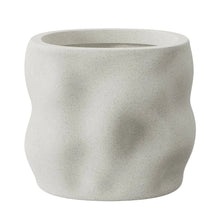 White resin planter with wide rim and speckled texture
