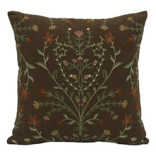 Brown embroidered decorative throw pillow with multicolor leafy branch and floral pattern